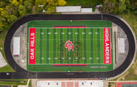 aerial photo of the outline of a 19 with the class of 19 students on football field